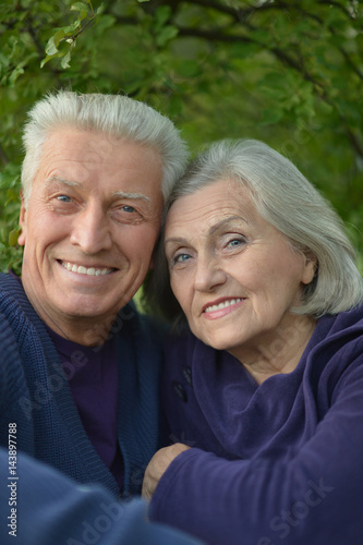 Happy elderly couple embracing