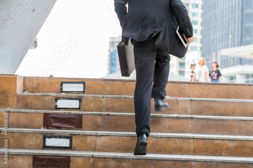 businessman  hurry up and running in business city street for rush hour.