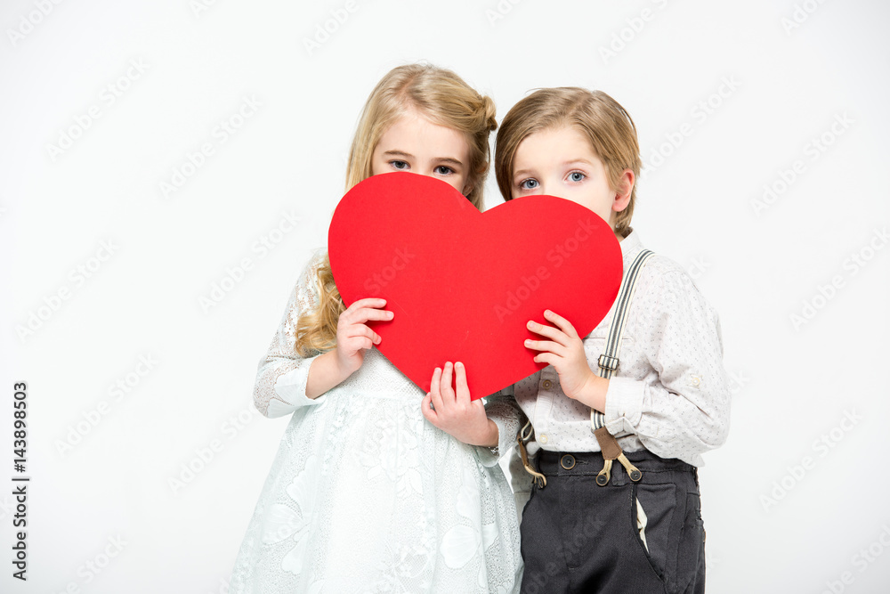 Kids holding red heart Kids holding red heart