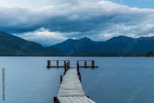 Wooden jetty at the mountain lake © superjoseph