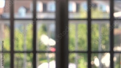Blurred square window frames. Summer behind windows, soft focus. Cheap and easy office rental.