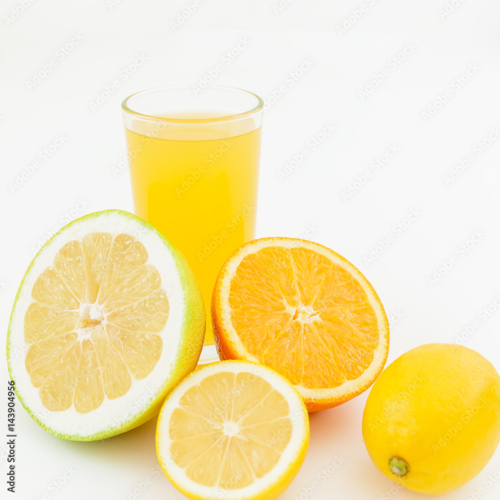Fresh juice of lemon, orange and sweetie on white background. Flat lay, top view. Fresh juice of lemon, orange and sweetie on white background. Flat lay, top view.