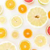 Pattern of fresh fruits - lemon, orange, mandarin, grapefruit and sweetie on white background. Flat lay, top view.