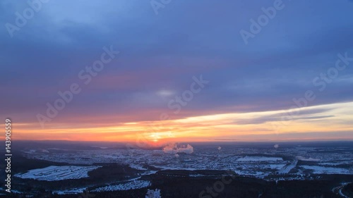 Sunset over the industrial city. The smoke from the chimneys. Revda, Ekaterinburg, Russia. Time Lapse. 4K photo