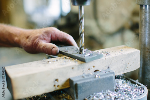 Drilling machine working on flat steel plate