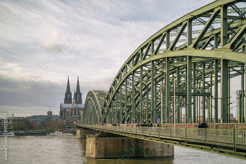 View on Cologne Cathedral and Hohenzollern Bridge over the Rhine river, © artjazz