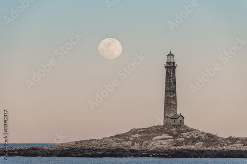 pink moon rising over thacher island