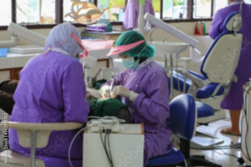 blur focus, the dentist  examining a patient teeth in medical treat dental
