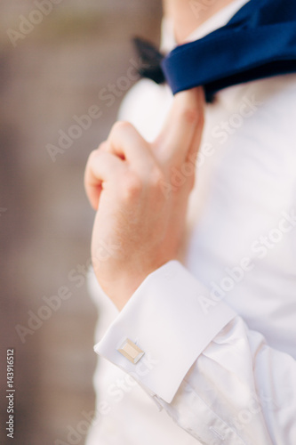 The jacket on the man is close-up. The bridegroom at the wedding.