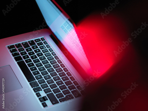 Cyber attack, laptop computer being infected by virus