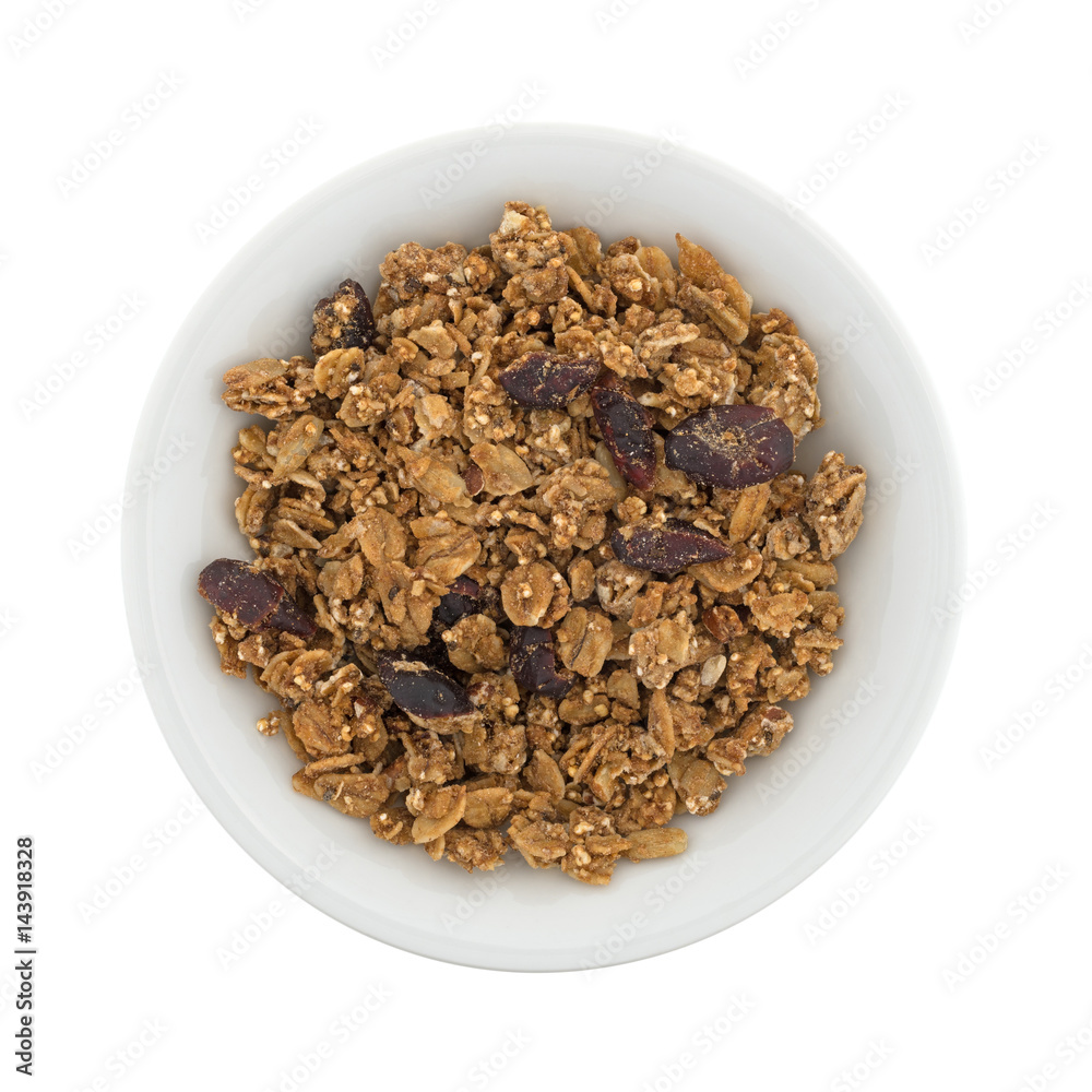 Top view of organic cranberry nut granola in a small white bowl.