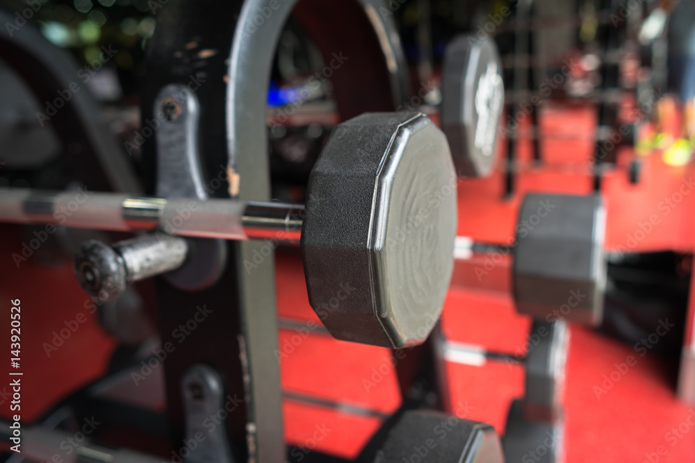 Rod and weights in the gym