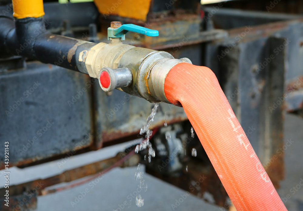 water flowing loss from rubber line tube use for save planet resource idea concept water flowing loss from rubber line tube use for save planet resource idea concept