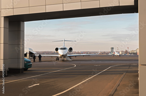 Workers filling aircraft before flight photo