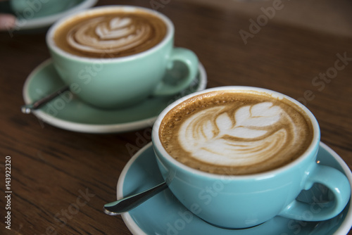 Cup of coffee with beautiful Latte art © behindlens