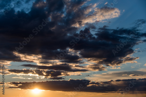Sunset sky with stormy clouds © ancamilushev
