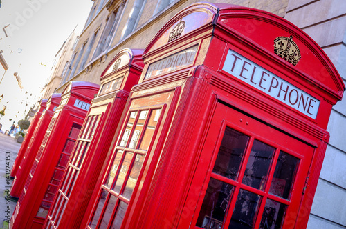 Iconic British red telephone boxes in a London street