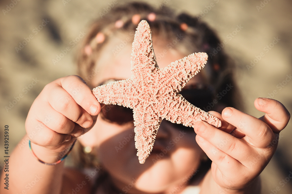 beautiful little girl with starfish beautiful little girl with starfish
