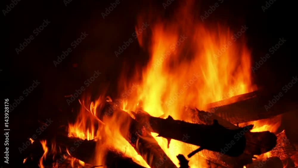 Bonfire burning trees at night. Bonfire burning brightly, heat, light,camping, big bonfire. Bonfire burning trees at night. Bonfire burning brightly, heat, light,camping, big bonfire.