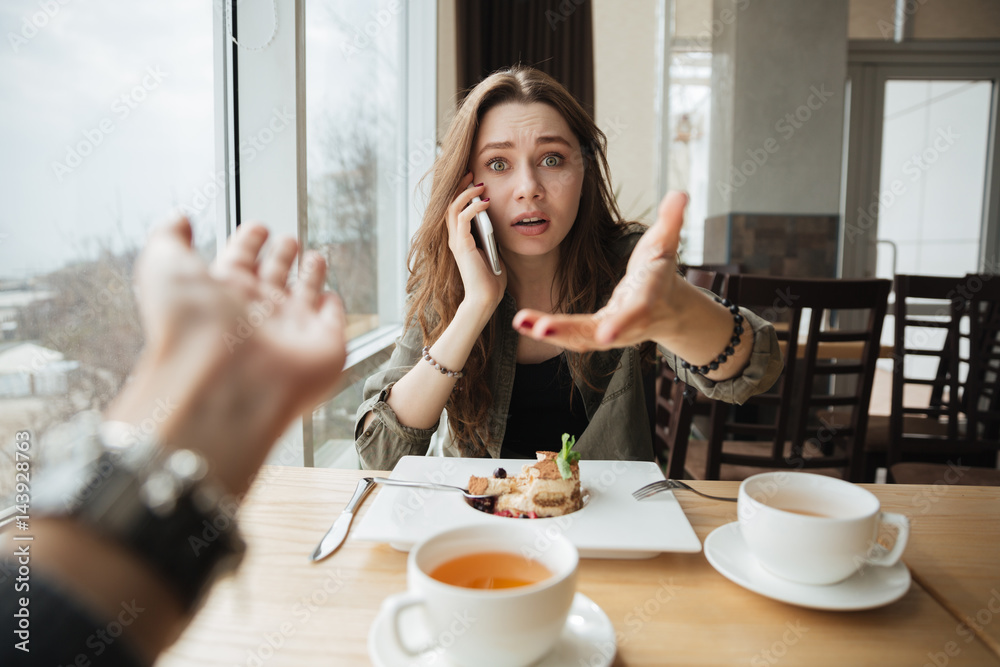 Dissatisfied woman in cafe