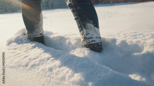 Girl feet walks in the snow