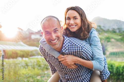 Piggyback mature couple photo