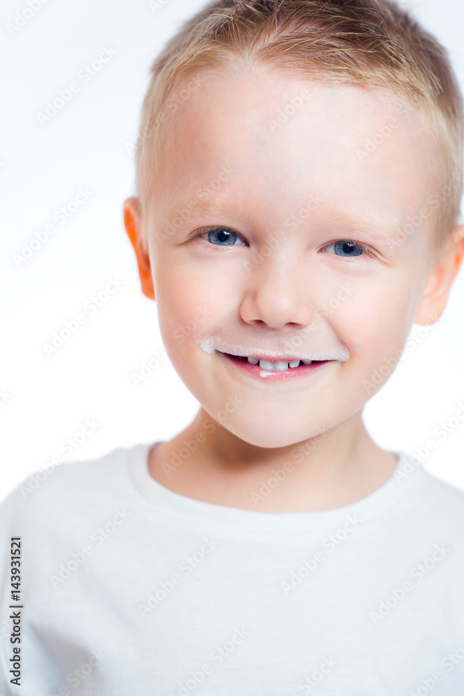 Portrait of a smiling little boy with milk on his lips Portrait of a smiling little boy with milk on his lips