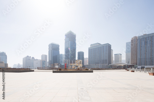 empty floor with modern cityscape and skyline © zhu difeng