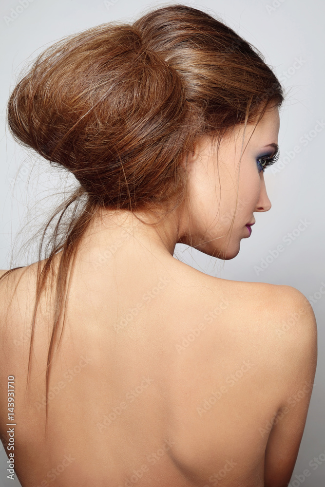 Young beautiful woman with stylish messy hair bun Young beautiful woman with stylish messy hair bun
