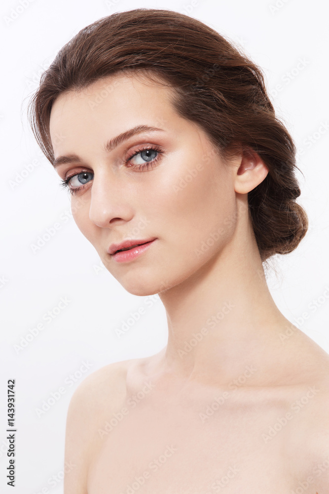 Young attractive woman with clean make-up and hair bun Young attractive woman with clean make-up and hair bun