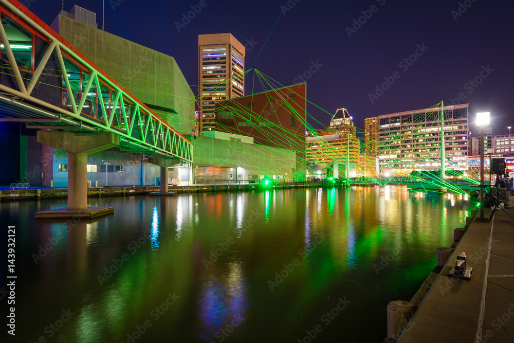 Light display and buildings at night, at the Inner Harbor in Baltimore, Maryland.