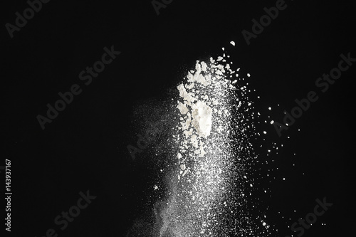 Cloud of flour on dark background