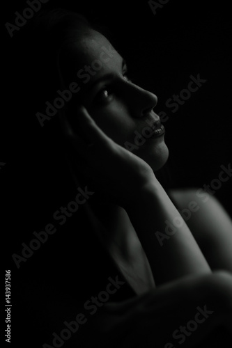 Studio portrait of a beautiful brunette on a black background