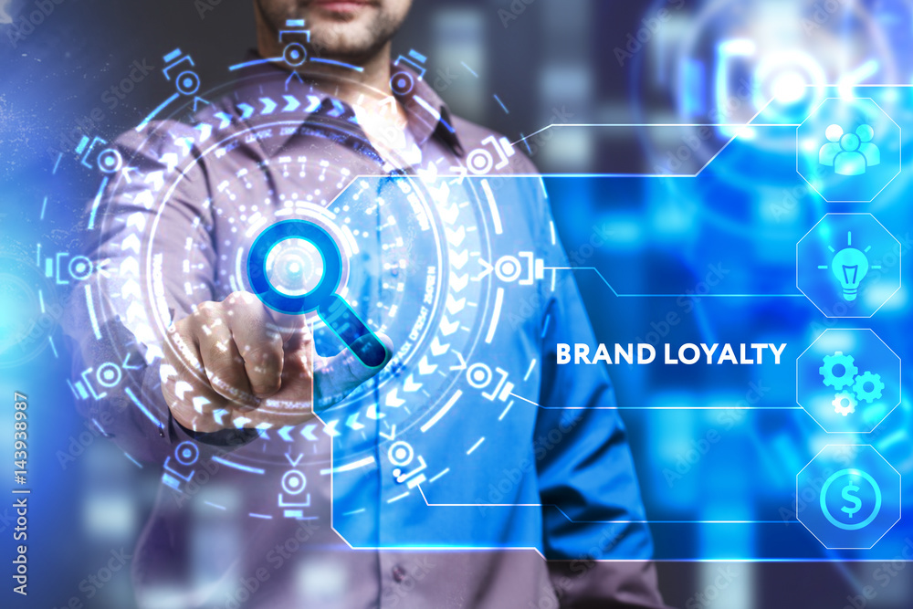 Business, Technology, Internet and network concept. Young businessman working on a virtual screen of the future and sees the inscription: Brand loyalty Business, Technology, Internet and network concept. Young businessman working on a virtual screen of the future and sees the inscription: Brand loyalty