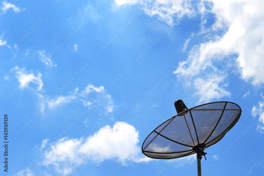 Satellite dish on the background of clouds and sky