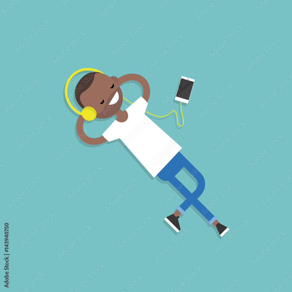 Happy young black man with headphones listening to music on a floor. Top view / flat editable vector illustration