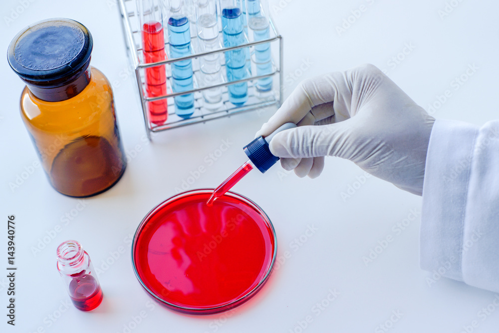 Scientist working at blood test in laboratory. Scientist working at blood test in laboratory.