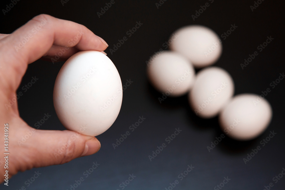 Egg white chicken in hand. Natural rustic food that gave birth to birds. Easter still life eggs clean. Egg white chicken in hand. Natural rustic food that gave birth to birds. Easter still life eggs clean.