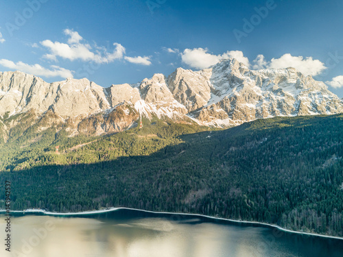 Aerial view of the Wetterstein mountains and the world famous Zugspitze in Bavaria in the evening light.