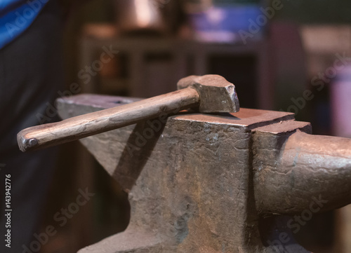 Hammer and anvil in blacksmith's house.