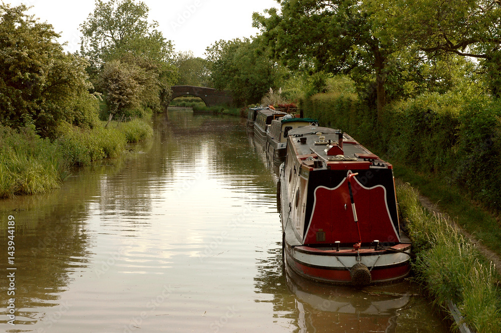 English narrowboats moored for the evening