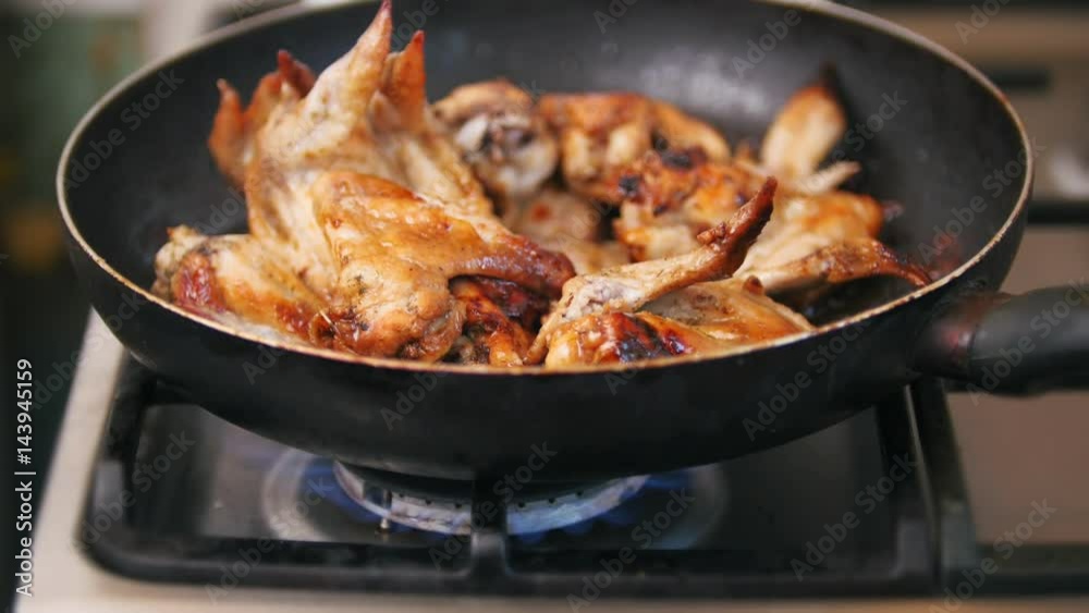Frying Chicken wings prepared in pan - Home food Frying Chicken wings prepared in pan - Home food