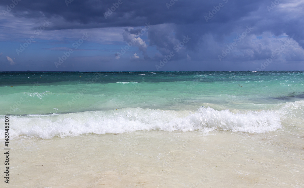 Storm is rising. Turquoise water with big waves. Dramatic sky in the background. Storm is rising. Turquoise water with big waves. Dramatic sky in the background.