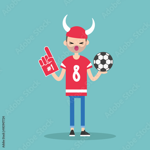 Young football fan wearing horned hat and foam finger / flat editable vector illustration, clip art