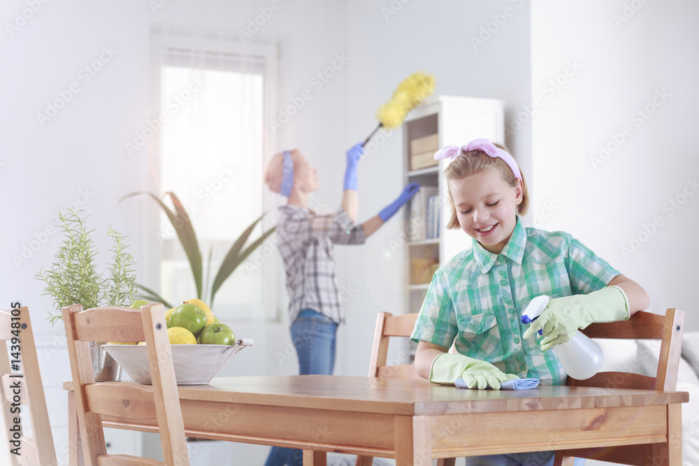 Girl wiping the table Girl wiping the table