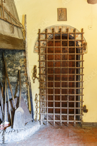 Kitchen with iron bars in front of a door photo