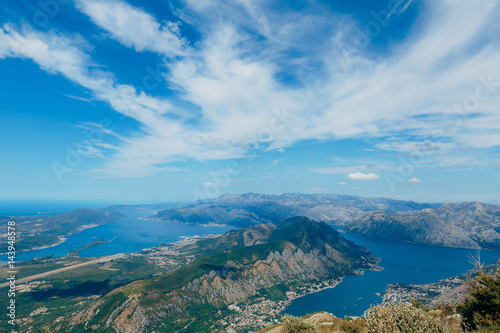 Bay of Kotor from the heights. View from Mount Lovcen to the bay. View down from the observation platform on the mountain Lovcen. Mountains and bay in Montenegro. The liner near the old town of Kotor. © Nadtochiy