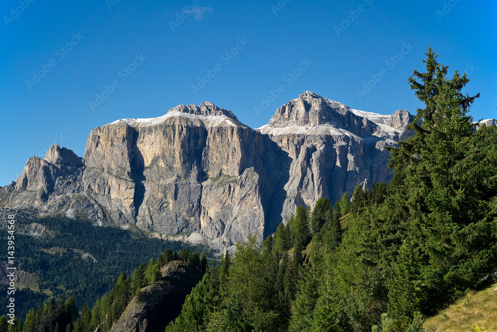 Scenic view of Sella group massif against blue sky Scenic view of Sella group massif against blue sky