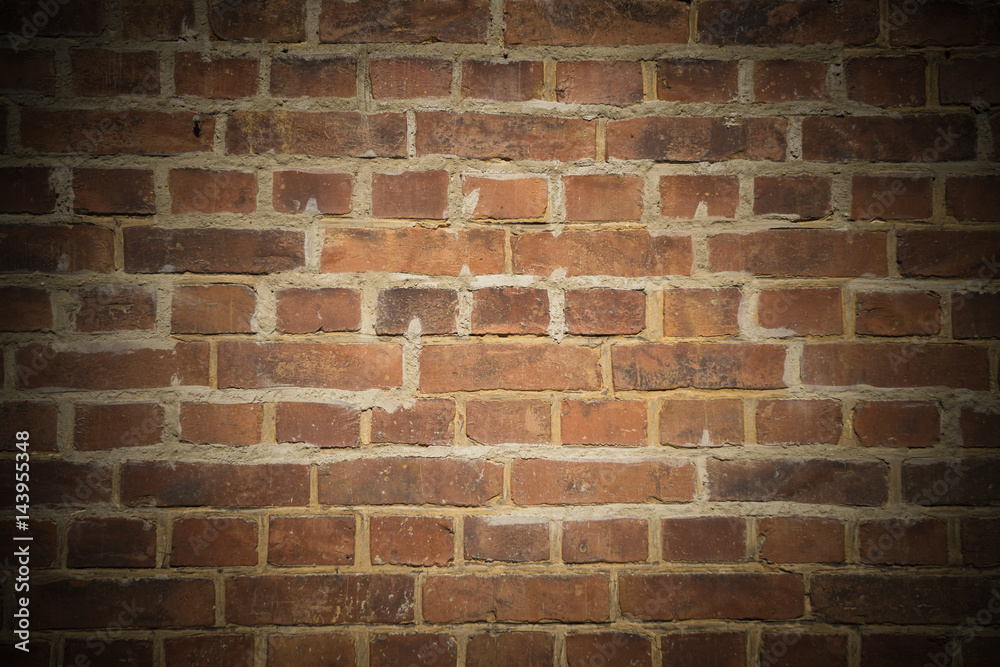 Obraz premium Backsteinmauer mit dunkler Vignette und Textfreiraum