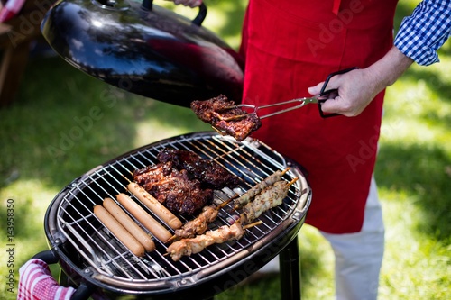 Man barbequing in the park